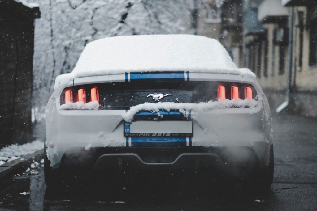 A car covered in snow during winter